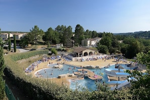 A resort with multiple swimming pools, lounge areas, and a view of the surrounding landscape. - Cozy Apartment with Terrace (Vallon Pont D Arc)