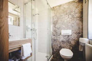 Shower, hair dryer, slippers, towels