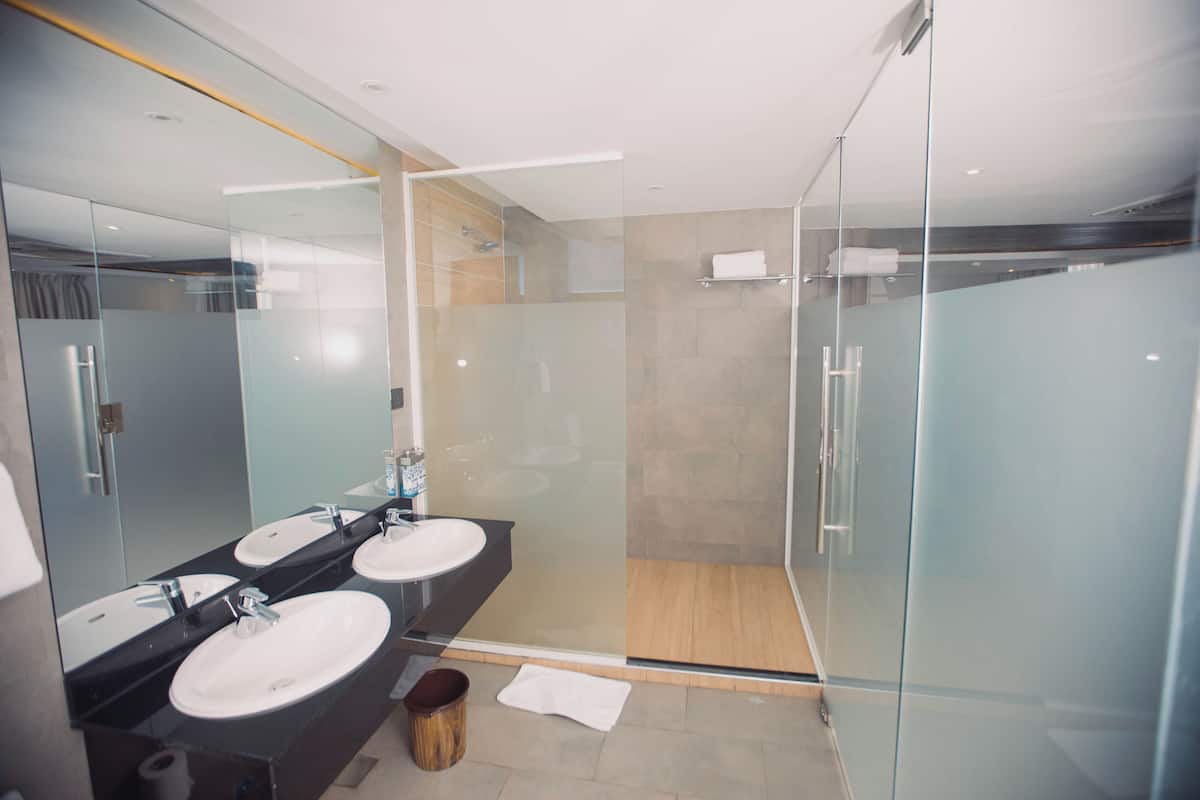 shower, rainfall showerhead, slippers, towels