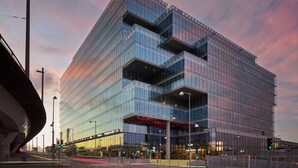 A modern glass building with a unique angular design, featuring multiple balconies and a prominent entrance with a red accent. - Scandic Goteborg Central (Gothenburg)