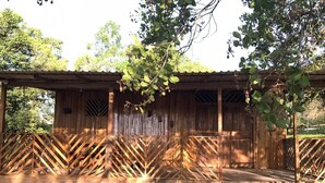 A rustic wooden structure with a covered porch and a small entryway. - Cabin (Provincia de Puntarenas)