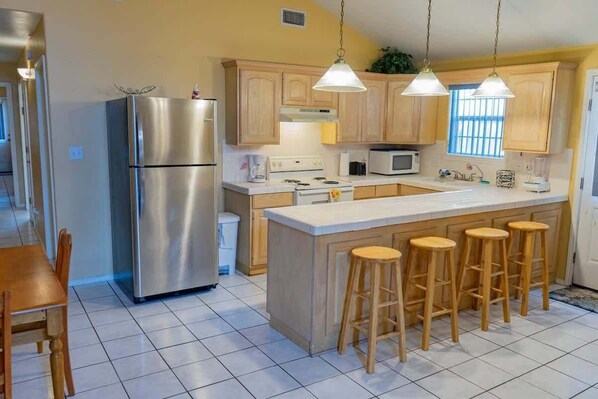 Townhome, 2 Bedrooms | Private kitchen | Fridge, oven, stovetop, coffee/tea maker