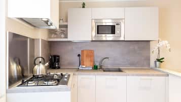 Fridge, microwave, stovetop, coffee/tea maker