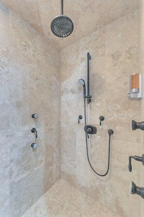 Bathtub, hair dryer, towels, shampoo
