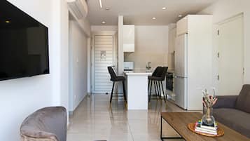 Executive Apartment | Living area | 43-inch Smart TV with cable channels, TV