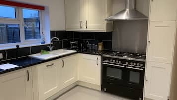 House, Multiple Beds | Private kitchen | Fridge, microwave, oven, stovetop