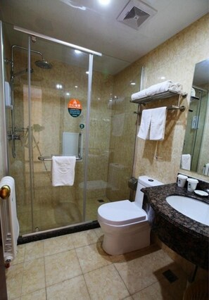 A modern bathroom with a glass-enclosed shower, a white toilet, a sink with a marble countertop, and a towel rack with two towels. - Greentree Inn Qinhuangdao Changli County Railway S (Qinhuangdao)
