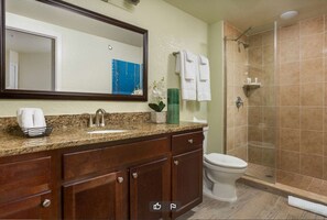 Bathtub, hair dryer, towels, soap