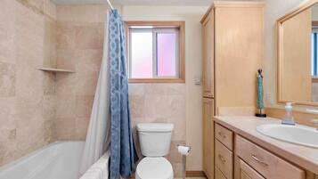Combined shower/tub, hair dryer, towels, soap