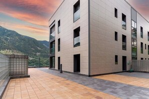 Enjoy panoramic views from the rooftop terrace with large tile flooring and expansive windows.