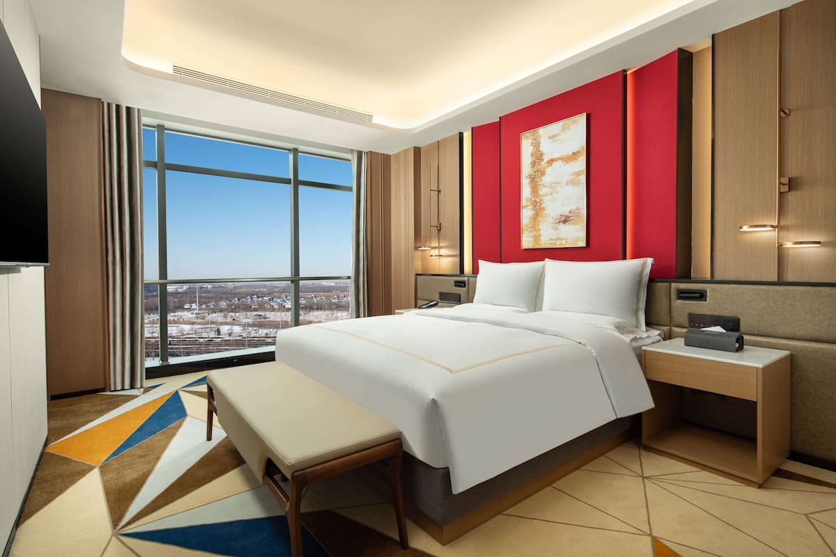 Suite Deluxe, 1 cama de matrimonio, fumadores | 1 dormitorio, edredones de plumas, minibar y caja fuerte
