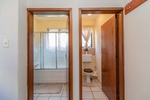 Combined shower/bathtub, soap, toilet paper