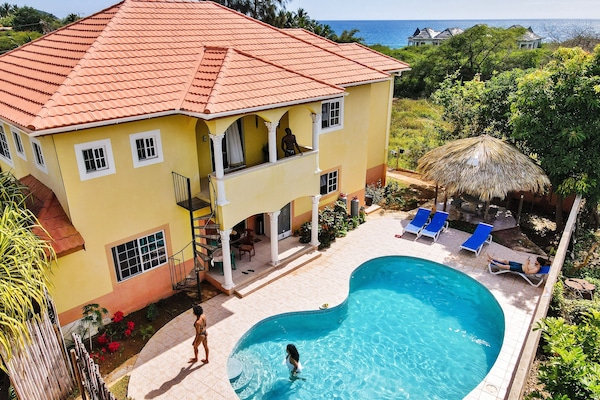 Seaside Villa pool, ocean view and backyard.
