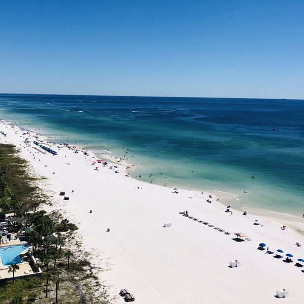 On the beach, sun-loungers, beach towels