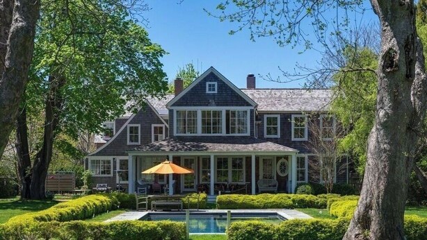 A large house with a covered porch, a swimming pool, and well-maintained landscaping. - Southampton Home #6 (Southampton)