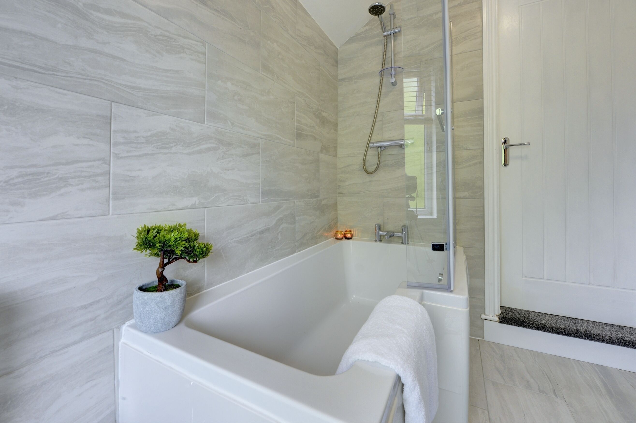 Combined shower/tub, hair dryer, towels, toilet paper