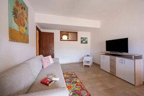 Family Apartment, Multiple Bedrooms (Sicilian Charm close to Taormina) | Living area | 21-inch TV with digital channels - Sicilian Charm Close to Taormina (Gaggi)