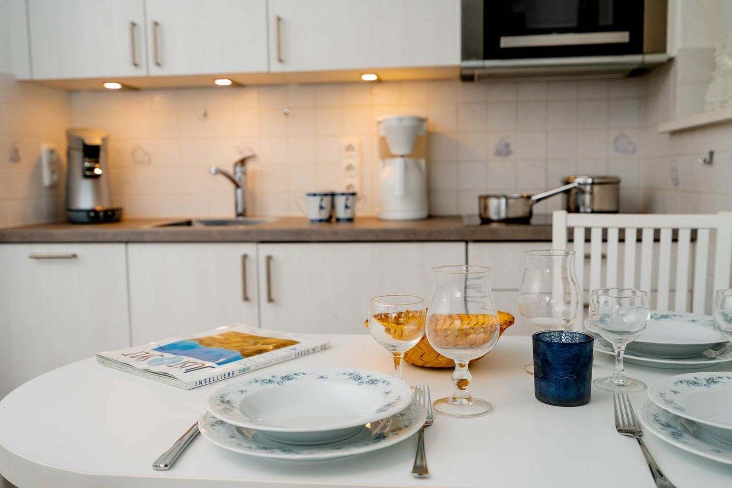 Fridge, stovetop, dishwasher, coffee/tea maker
