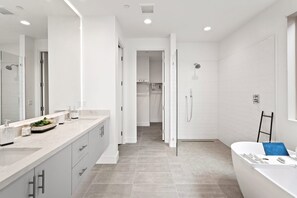 Bathtub, hair dryer, towels, soap