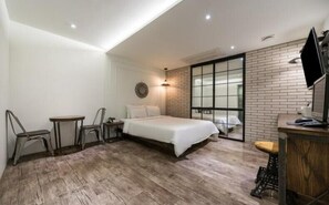 A modern hotel room with a large bed, a desk, a chair, and a TV. - Hotel DAYS.A (Busan)