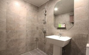 A bathroom with a shower, a sink, and a mirror. - Hotel DAYS.A (Busan)