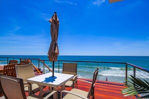 Outdoor dining - Luxury Oceanfront Retreat w/ Breathtaking Ocean Views, Sun Decks & Stunning Architectural Details (Folly Beach)