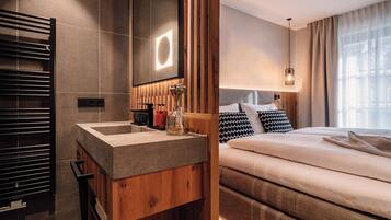 Hypo-allergenic bedding, down comforters, minibar, in-room safe