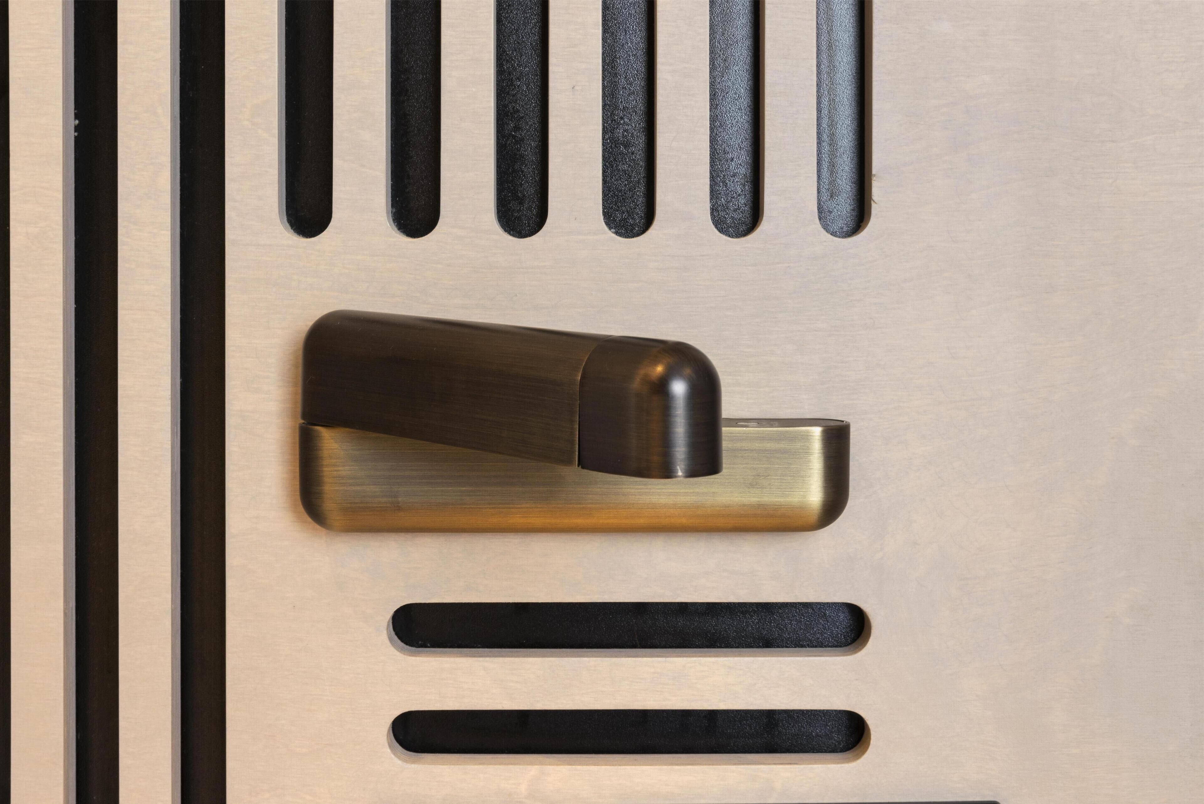 A door with a metallic handle and a keyhole.