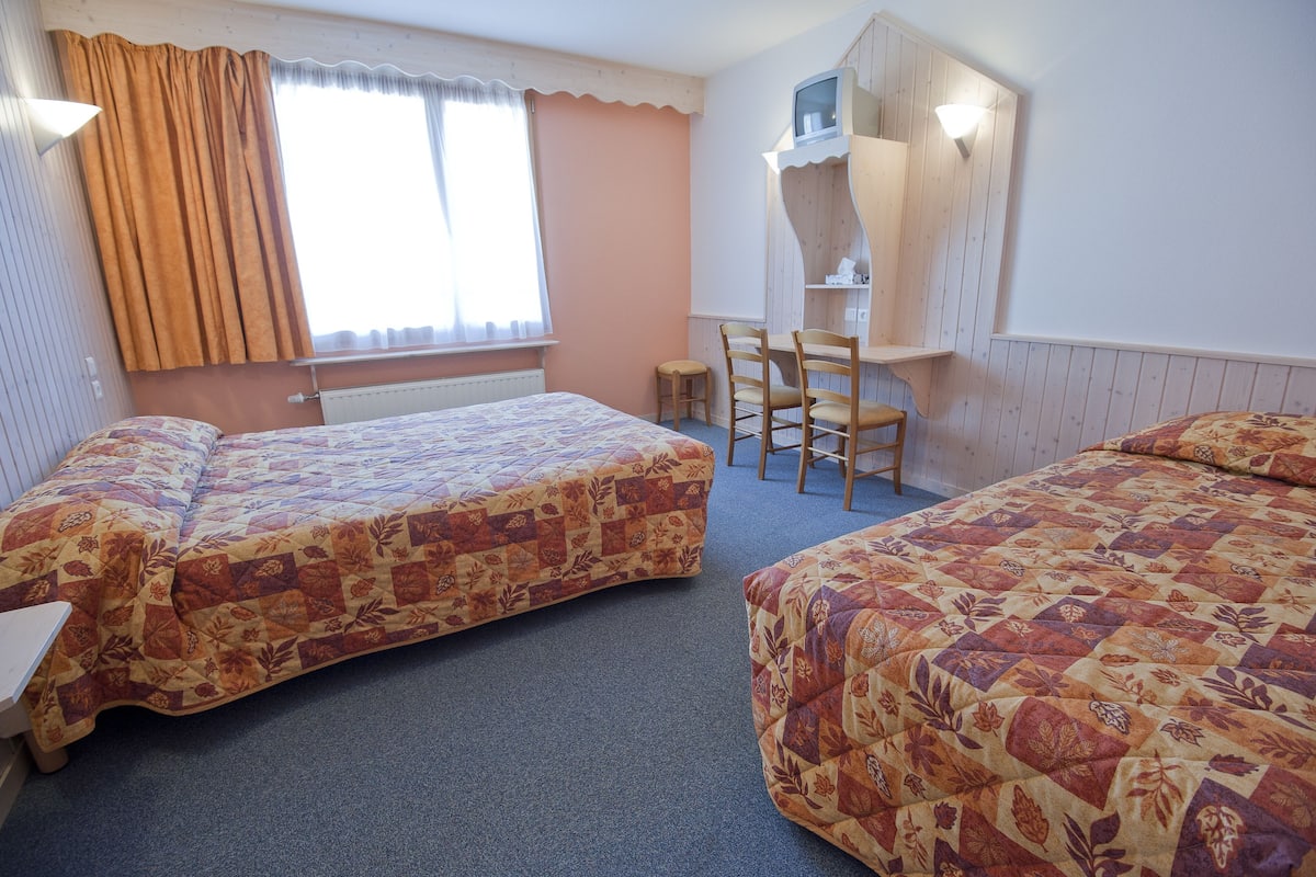 Premium bedding, desk, laptop workspace, blackout curtains