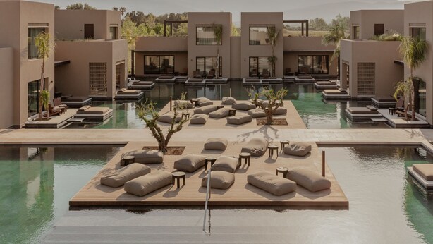 A modern resort with a central pool, lounge areas, and mountain views. - Casa Cook Samos (Samos)