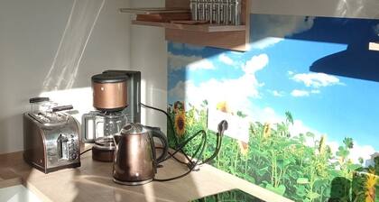 Guesthouse Rand Berlin-*Sonnenblume* for 3 adults or 2 adults + 2 children up to 12 years.