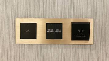 A control panel with three buttons labeled "Bedroom," "Make Up Room," and "Insert Card For Power."