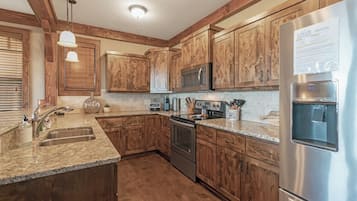 Dishwasher, coffee/tea maker, cookware/dishes/utensils, dining tables