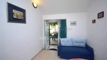 Apartamento, 1 quarto, para fumantes, varanda | Sala de estar | TV