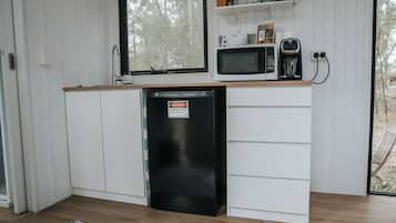 Fridge, microwave, coffee/tea maker, cookware/dishes/utensils