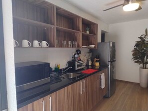Fridge, microwave, stovetop, coffee/tea maker