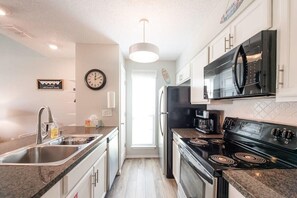 Fridge, microwave, oven, stovetop - "Coastal Vibes" One Block from Beach-Unit 1011-Island Dunes Condominiums (Port Aransas)