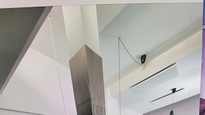A modern kitchen with a central island, built-in appliances, and pendant lighting. - Golf & Sea Top location (Villamartin)