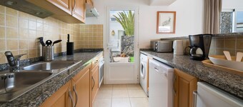 B1, in a small complex with communal heated pool 100m from the sea