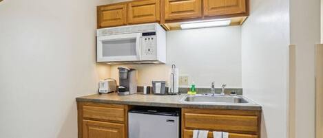 Fridge, microwave, coffee/tea maker, toaster