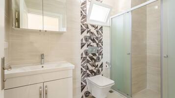 Bathtub, hair dryer, towels