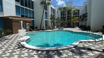 Outdoor pool, open 7:00 AM to 9:00 PM, sun loungers