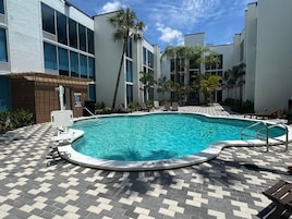 Outdoor pool, open 7:00 AM to 9:00 PM, pool loungers