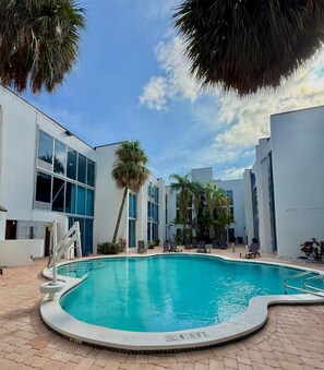 Outdoor pool, open 7:00 AM to 9:00 PM, sun loungers