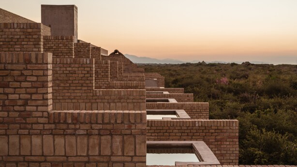 A series of brick steps leading to a flat roof with a view of a mountainous landscape. - Terrestre, a Member of Design Hotels (Villa de Tututepec de Melchor Ocampo)