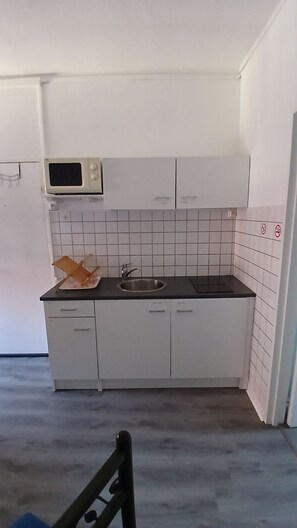 Fridge, microwave, stovetop, coffee/tea maker