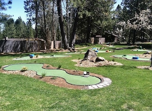 Play a round of golf in a beautifully landscaped outdoor setting.