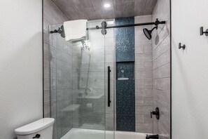 Combined shower/tub, hair dryer, towels, soap
