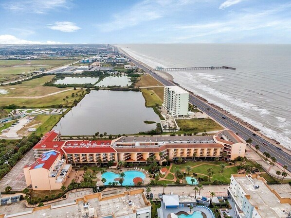 A coastal hotel with multiple swimming pools, a beach, and a pier. - 3 Amazing Pools | Hot Tub | Stunning Ocean View (Galveston)