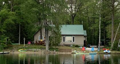Wonderful house on sandy beach, sports lake close to golf, bike/snowmobile trail
